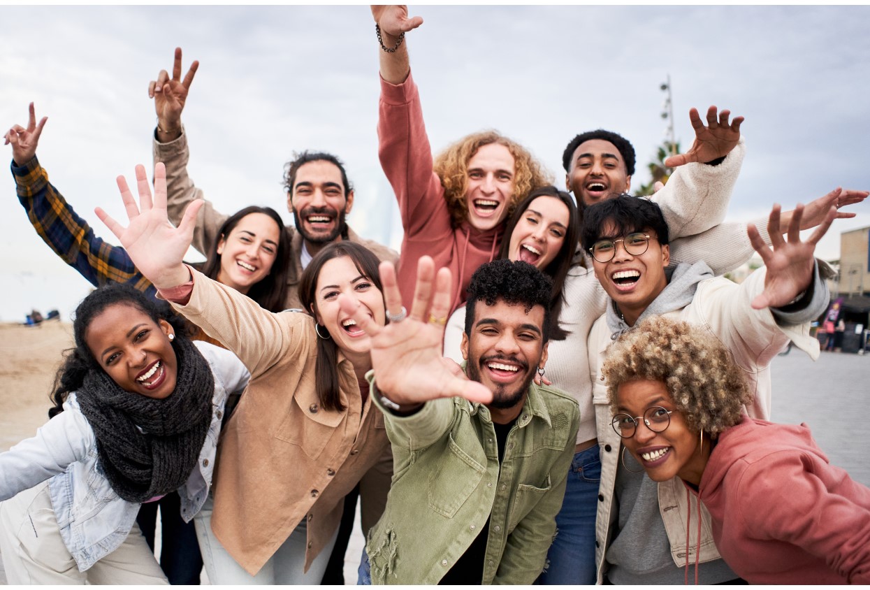Big group of cheerful young friends