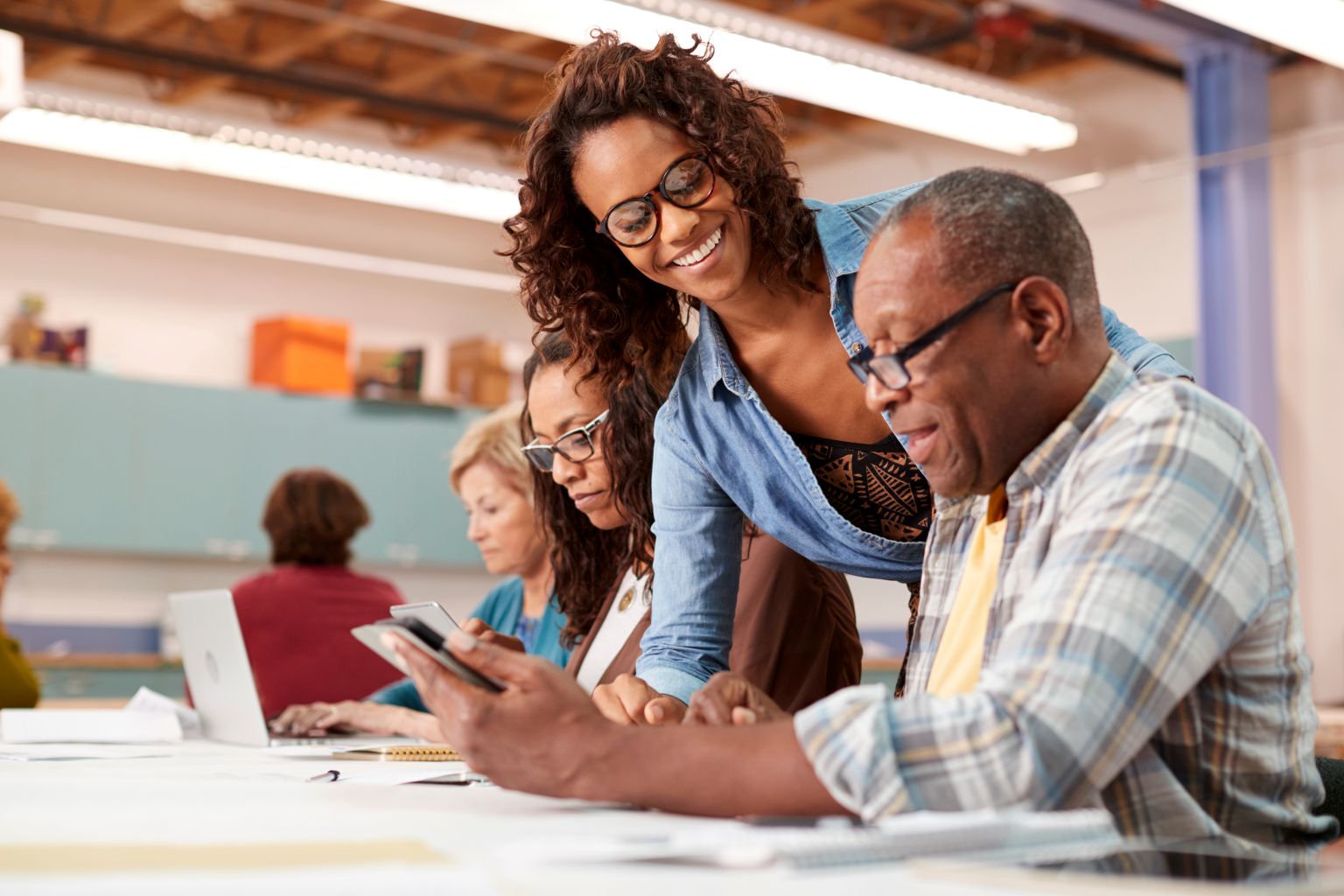 Teacher Helping Retired Senior Man